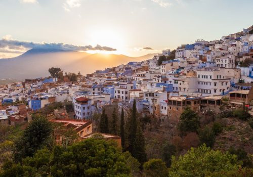 Chefchaouen aerial panoramic view at night. Chefchaouen is a city in northwest Morocco. Chefchaouen is noted for its buildings in shades of blue.